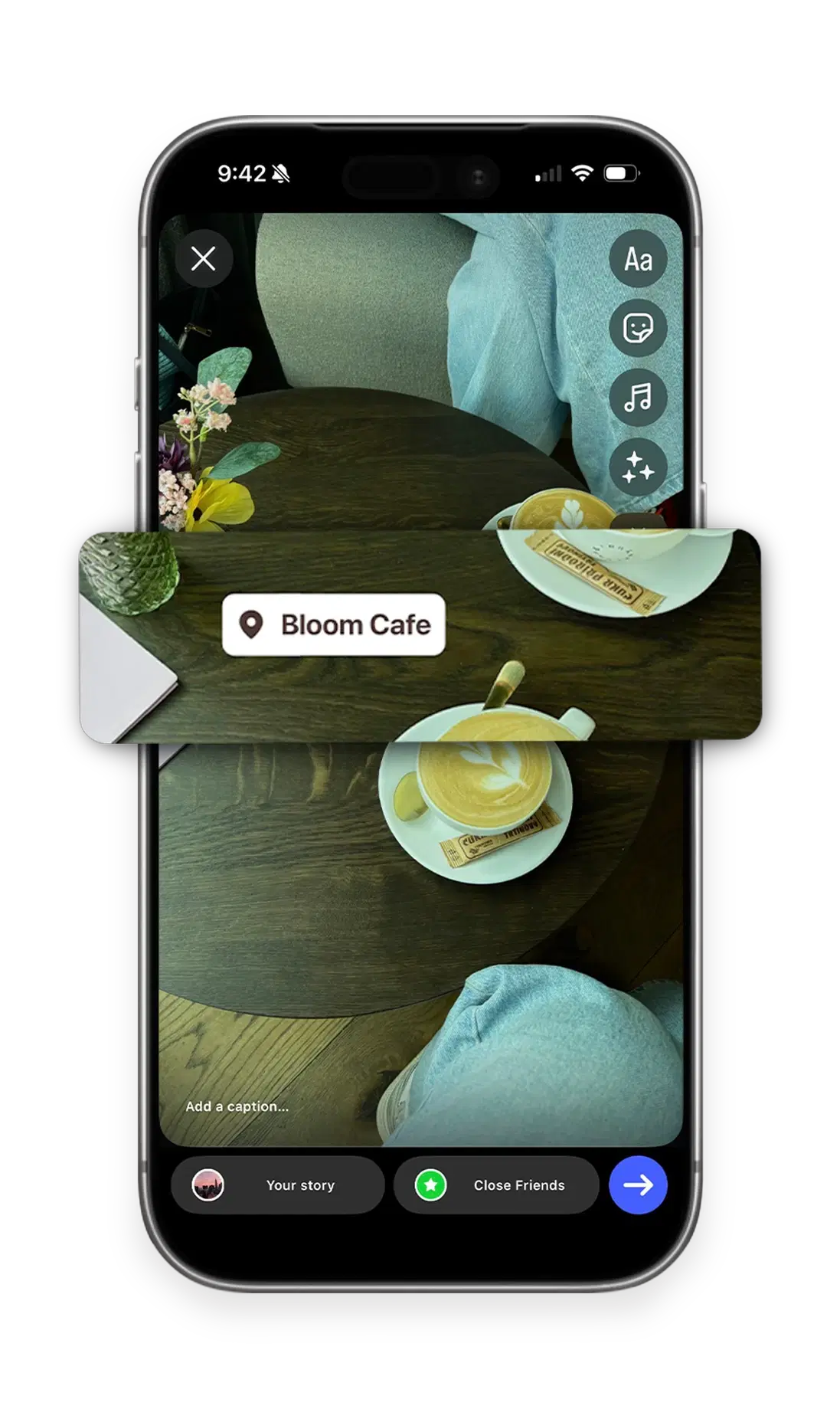 The Instagram Story composer with a photo of coffee on a dark wooden cafe table and a Bloom Cafe location sticker placed on it